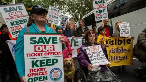 Getty Images Demonstrators led by disability rights campaigners march towards Parliament on August 31, 2023 in London