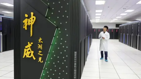 Getty Images Researcher with Chinese supercomputer