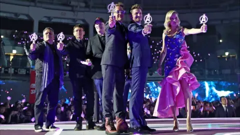 Getty Images The Avengers cast and crew (L-R): Joe and Anthony Russo, Kevin Feige, Robert Downey Jr, Jeremy Renner and Brie Larson