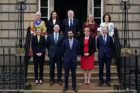 PA Media The new cabinet team consists of six women and three men