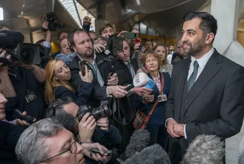Jane Barlow / PA Media Humza Yousaf speaks to the media, 28 March 2023