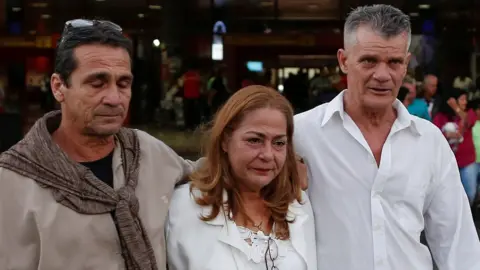 Reuters Cuban doctor Rosa Elena Soto, who worked for two years in a small town in Brazil, walks with relatives at the Jose Marti International Airport after arriving from Brazil, in Havana, Cuba, November 23, 2018.