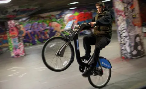 Getty Images Teenager doing stunts on bike on South Bank