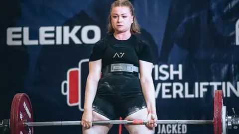 Hutton Moor Leisure Centre Phoebe Pothecary lifting a heavy weight in a gym