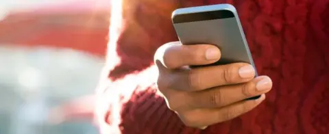 Getty Images Person using mobile phone