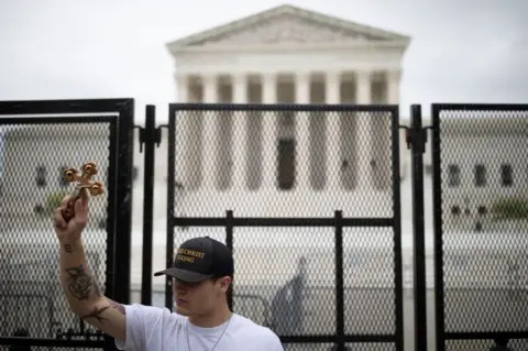 Getty Images A security fence was erected outside the court after the leak of the draft opinion