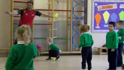 Primary school pupils doing PE