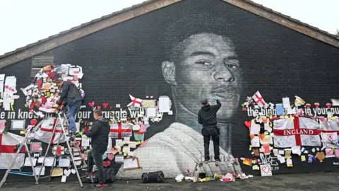 PA Media The mural of Marcus Rashford has now been cleaned