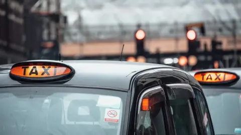 Getty Images Taxis lined up at station