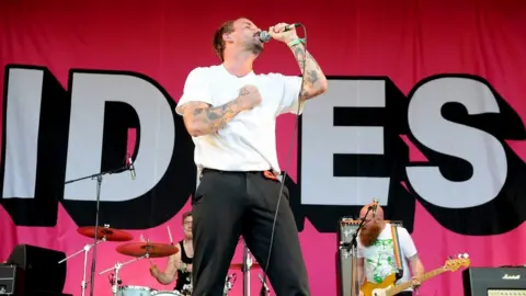 Getty Images Joe from Idles on stage