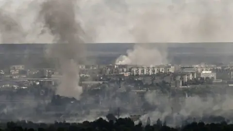 Getty Images Smoke rises above Severodonetsk