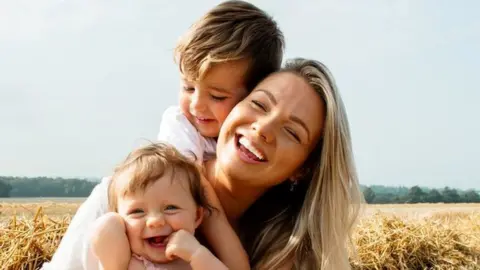 Alex Robins with her son and daughter