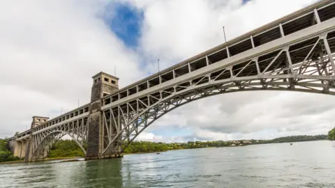 FatManPhotoUK/Getty Images Britannia Bridge over to Anglesey