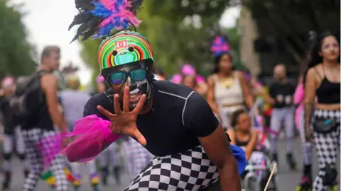 Victoria Jones/PA Wire Notting Hill Carnival goers