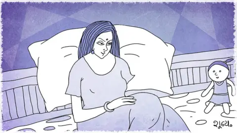 A woman sitting on a bed