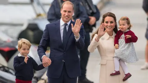 PA The Duke and Duchess of Cambridge with their two children