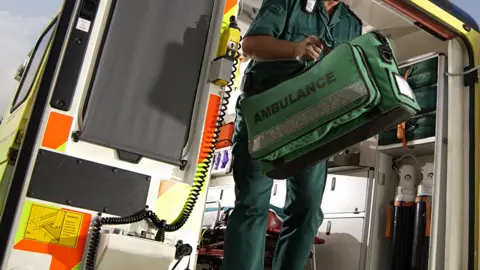 Getty Images Shot of ambulance worker leaving ambulance