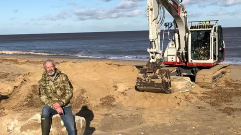 Lance Martin with a digger