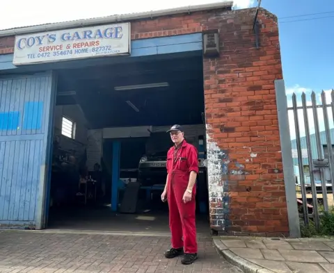 Mo Kitchen in front of Coy's Garage, Grimsby