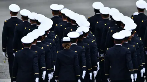 Getty Images French soldiers march during the annual Bastille Day military parade in Paris, 2019
