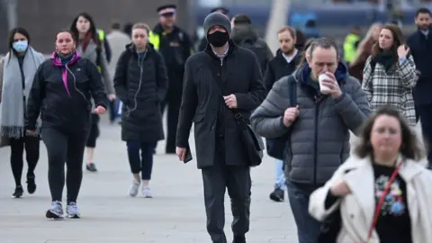 Reuters File image of workers crossing London Bridge during the morning rush hour on 21 March