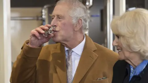 James Glossop/PA Media King Charles sampling gin