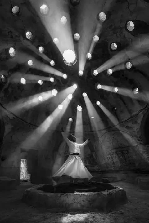F Dilek Uyar / National Geographic A whirling dervish raises his arms