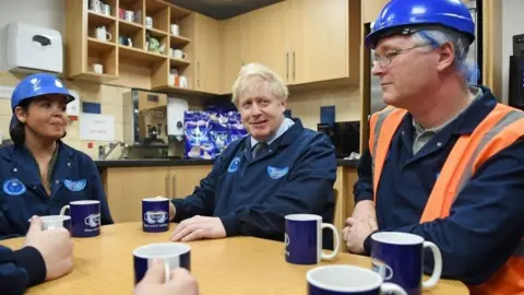 PA Media Boris Johnson visits a factory