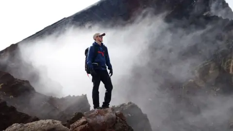 Ash Dykes Ash Dykes climbing a mountain
