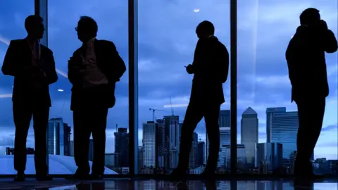 Businessmen against City of London backdrop