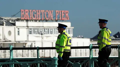 Reuters Police on patrol by Brighton pier