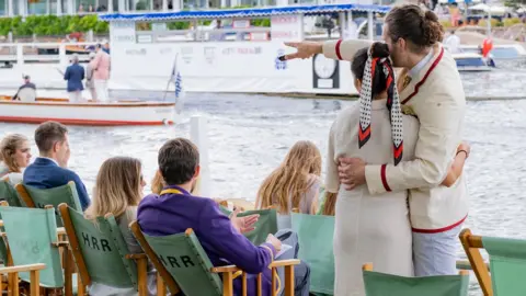 James Finlay People watch rowers on the river at the Henley Royal Regatta