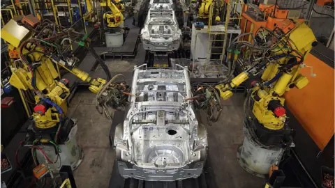 Getty Images Robots in a factory