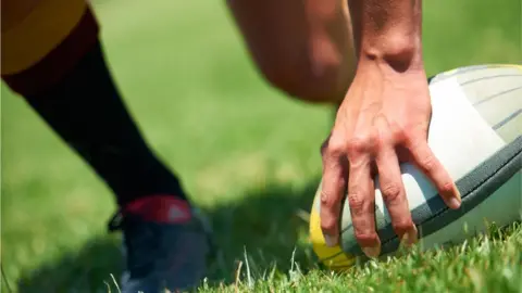 Getty Images Rugby ball on pitch, generic