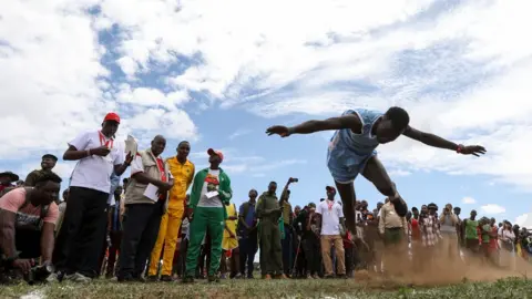 EPA A Maasai Moran lifts off the ground while competing in the Javelin competition