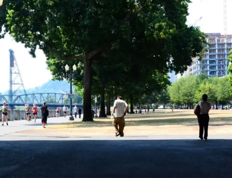 BBC Homeless people walk on Portland's water front