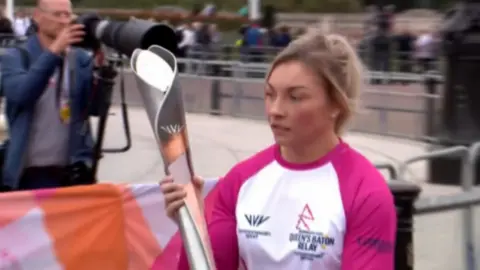 Lauren Price with Queen's Baton at 2022 Relay launch in London