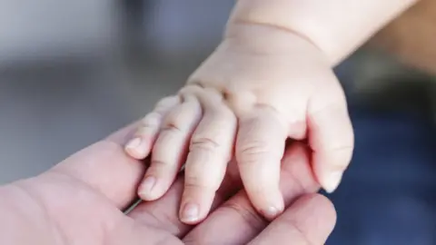 Getty Images Baby hand