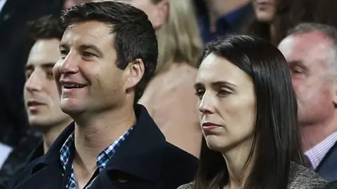 Reuters New Zealand Labour Party leader Jacinda Ardern (2nd R) and her partner Clarke Gayford (2nd L) stand at an international netball match in Auckland, New Zealand, October 5, 2017.