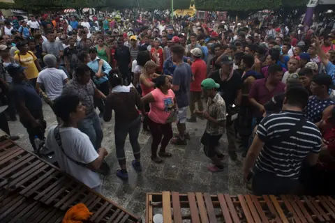 Encarni Pindado Migrants dance was local musicians play music in the central square of Ciudad de Hidalgo