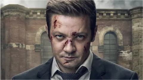 Paramount Jeremy Renner with cuts on his face in the original poster image for Mayor of Kingstown