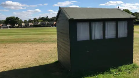 The current scorers box is a converted garden shed.