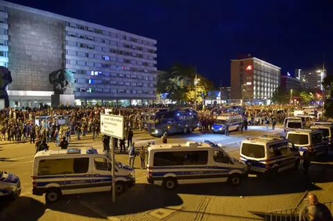 Reuters Police vehicles in central Chemnitz, 27 August