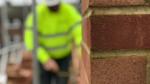 Getty Images Blurred builder in hi-vis jacket