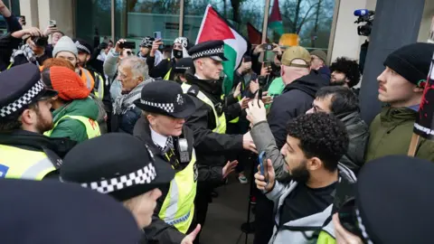 PA Media Police officers at protest