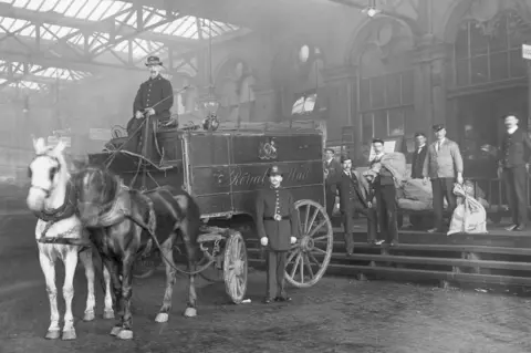 Getty Images The first Penny Post dispatch arrives at Waterloo Station in the 19th Century