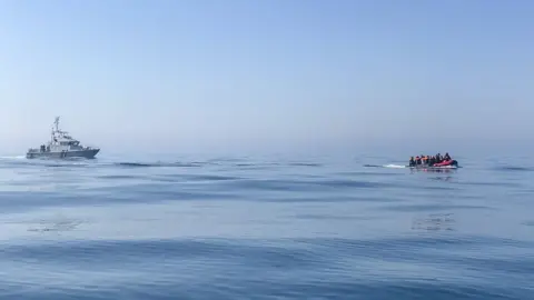 AJM Images Migrants in the Channel back in August were escorted by French officials, and given over to the care of British Border Force