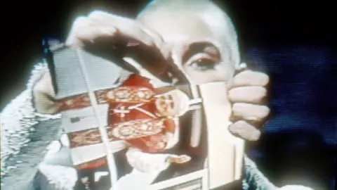 Getty Images Sinead O'Connor ripping up a photo of the Pope on Saturday Night Live in 1992