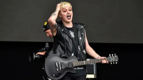 Getty Images Ian Miles on stage