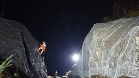 Network Rail Installing protective netting at a rock cutting